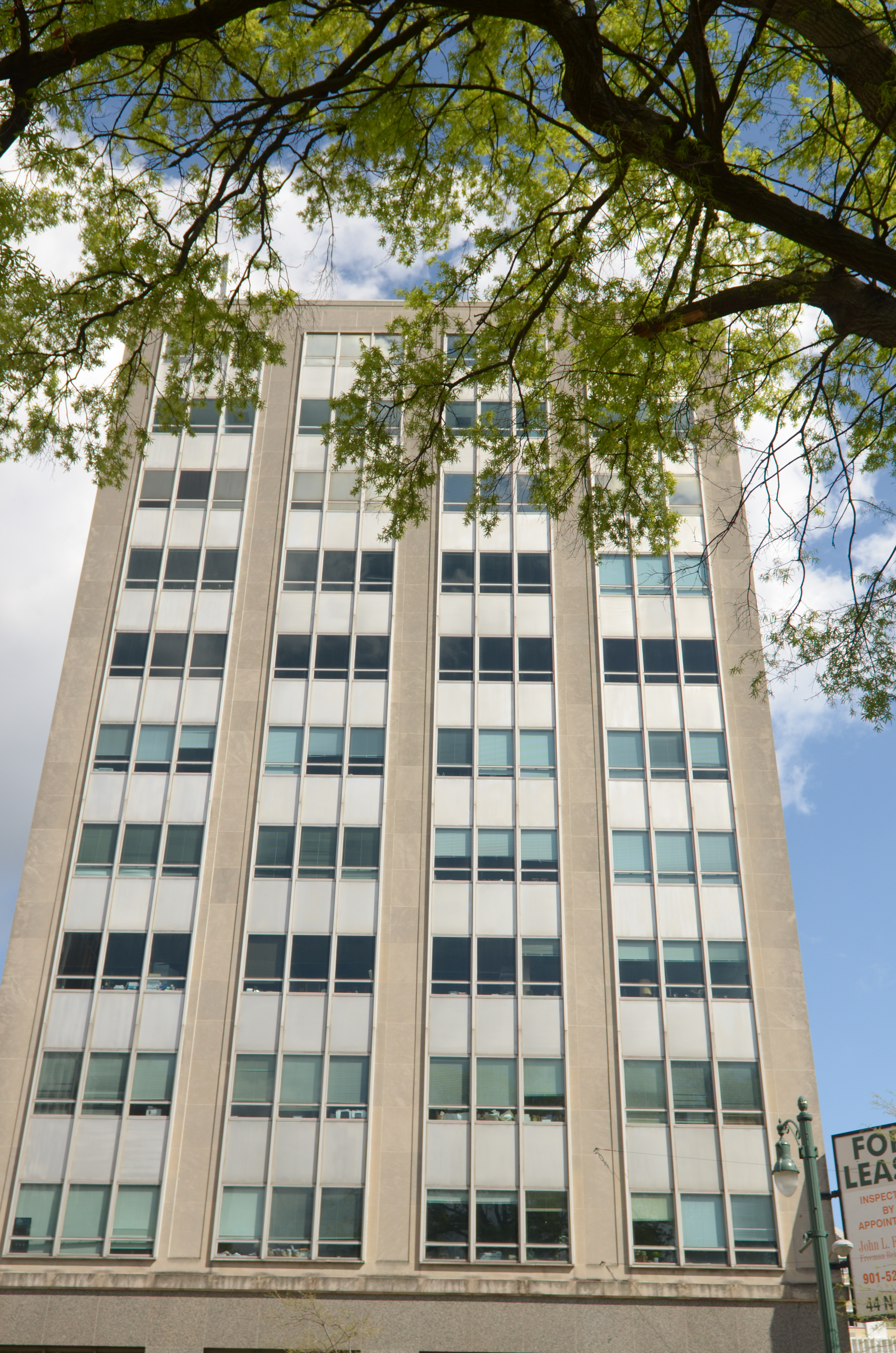 The Grosvenor Building's distinctive vertical window bays and stone façade
